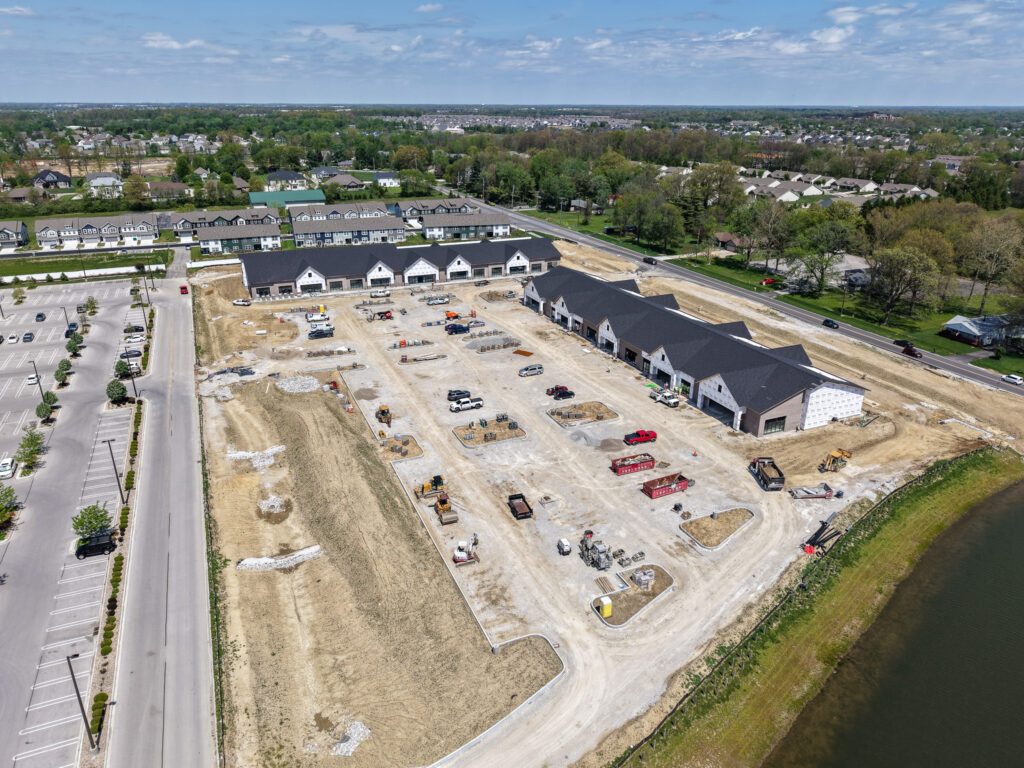 aerial drone view of retail shopping center construction site